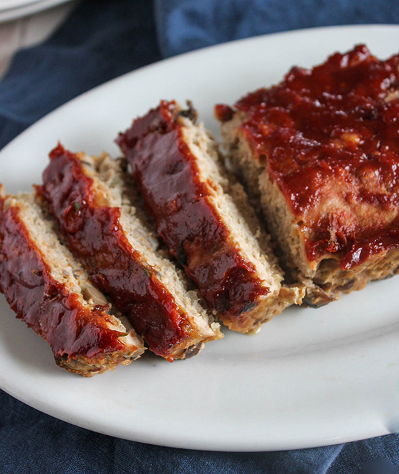 Turkey meatloaf sliced on a white plate