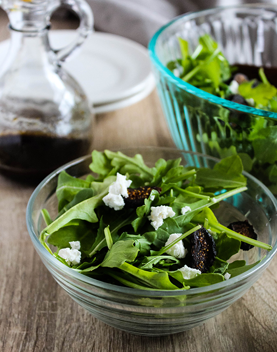 Arugula salad made with figs goat cheese and almonds