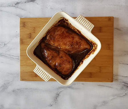 a picture of chicken breasts in marinade