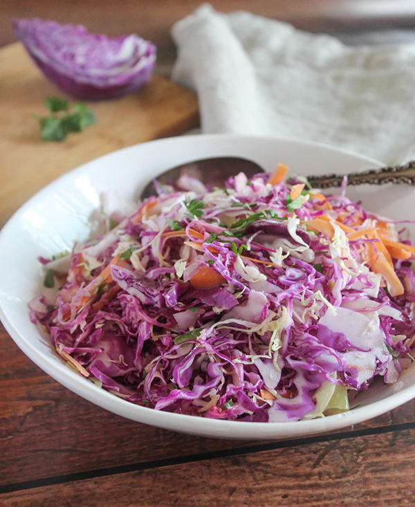 coleslaw salad in a white bowl
