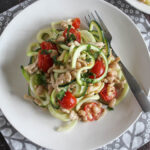 zucchini noodles with chicken on a plate