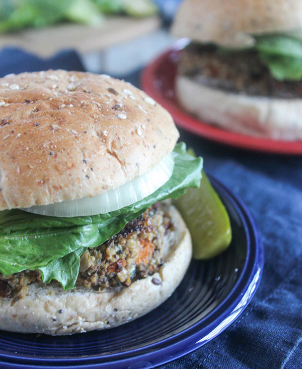 mushroom veggie burger with a roll on a plate