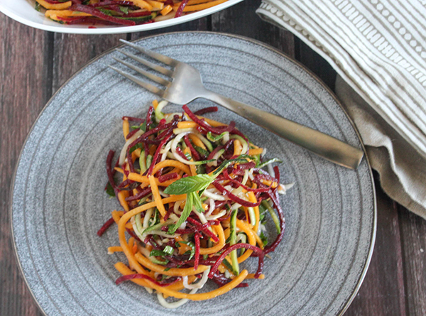 a view looking down at veggie noodle salad on a plate