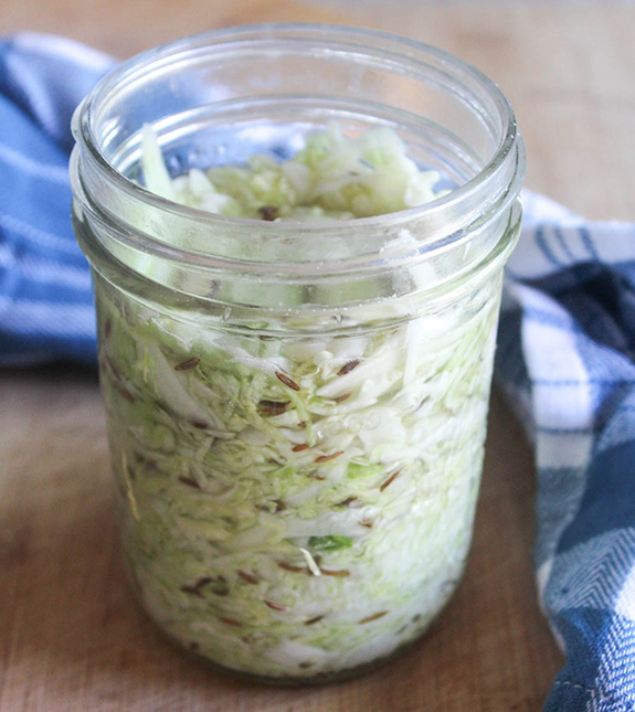 Process step 2 sauerkraut stuffed into a mason jar