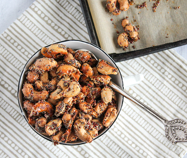 an overhead shot of maple cashews in a bowl