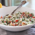 cauliflower tabbouleh salad in a bowl with a spoon