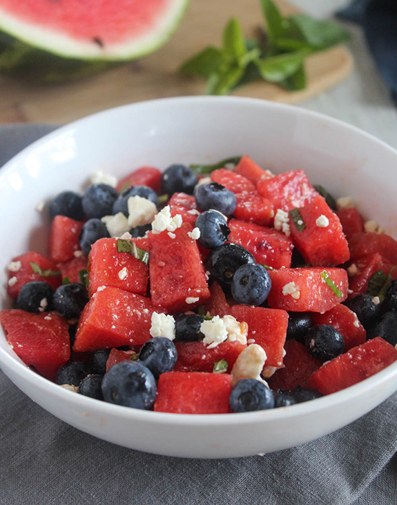 Red white and blue salad in a white servinb bowl