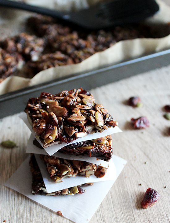 Chocolate grain free granola bars stacked on a table