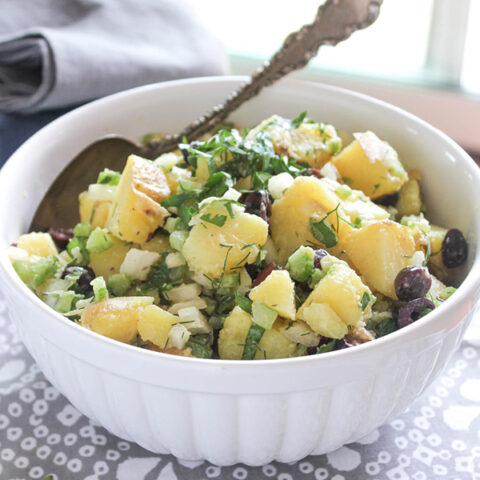 Healthy potato salad in a bowl with a spoon