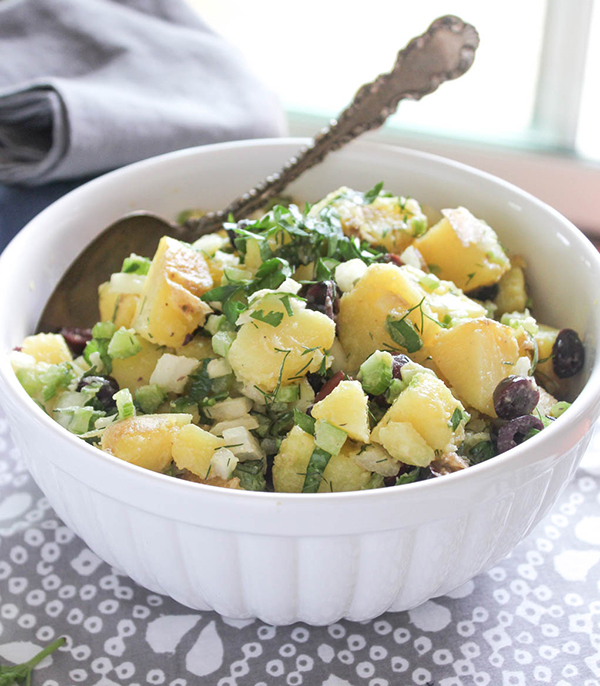 Healthy potato salad in a bowl with a spoon