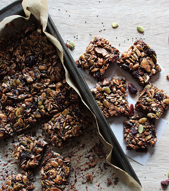 Chocolate grain free granola bars on a table in a baking pan