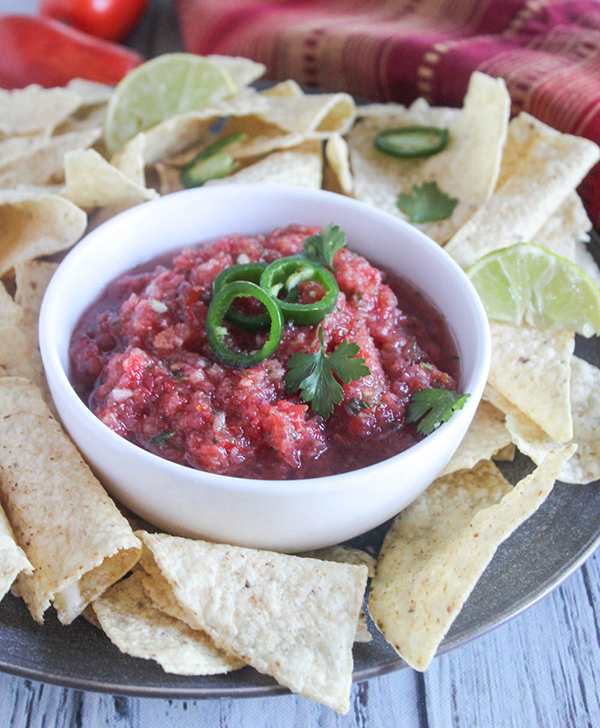 salsa in a bowl with chips surrounding it