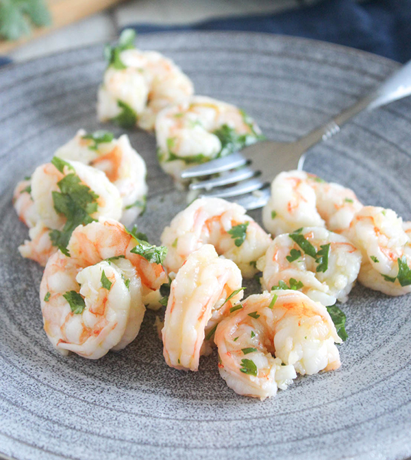 cilantro lime shrimp on a plate with a fork