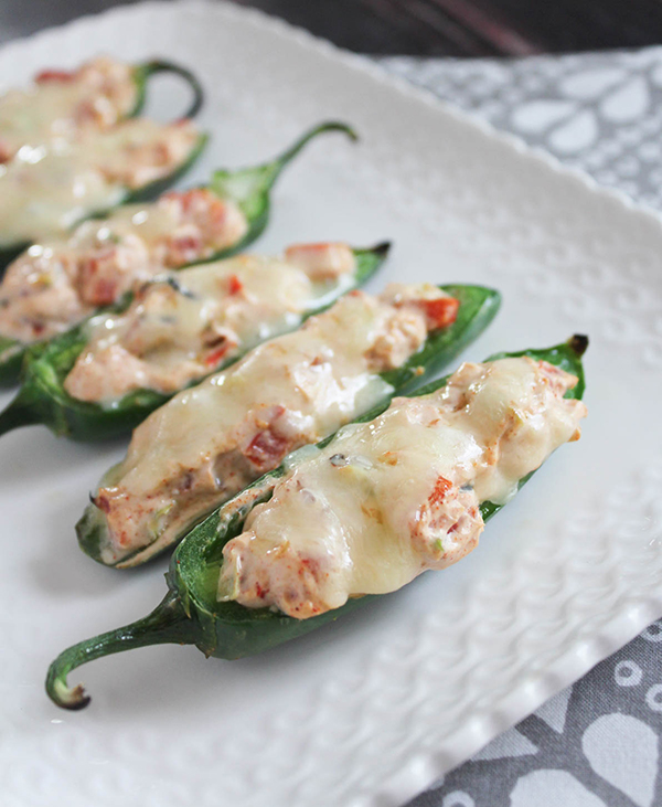 jalapeno poppers grilled on a white platter