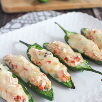 jalapeno poppers grilled close up on a white platter