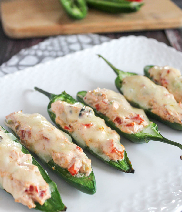 jalapeno poppers grilled close up on a white platter