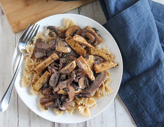 Overhead veiw of mushroom stroganoof on a plate with a fork