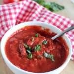 homemade marina sauce in a bowl with a spoon