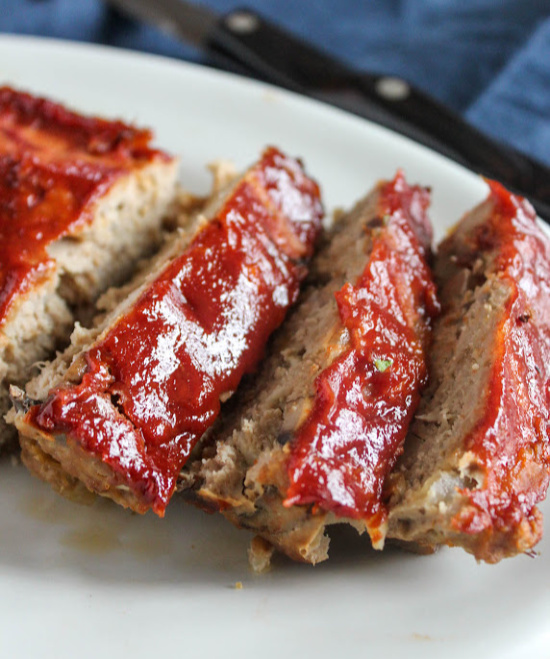 a close up of meatloaf slices on a plate