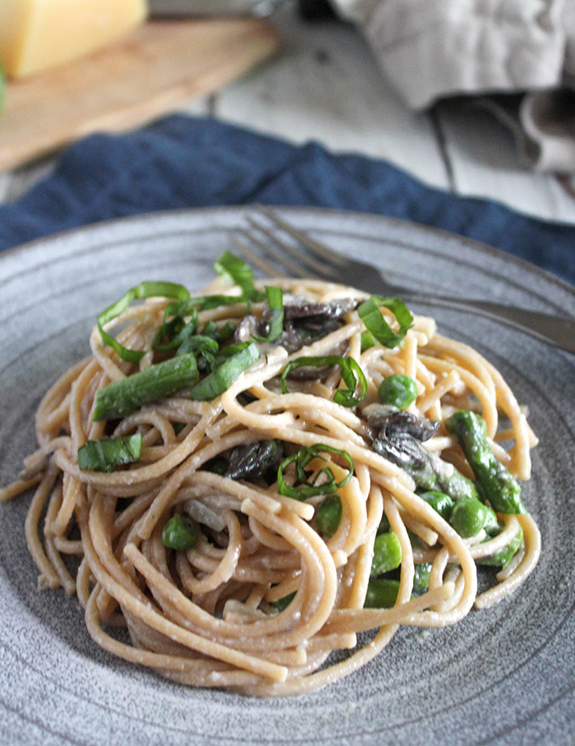 Creamy pasta with vegetables on a plate