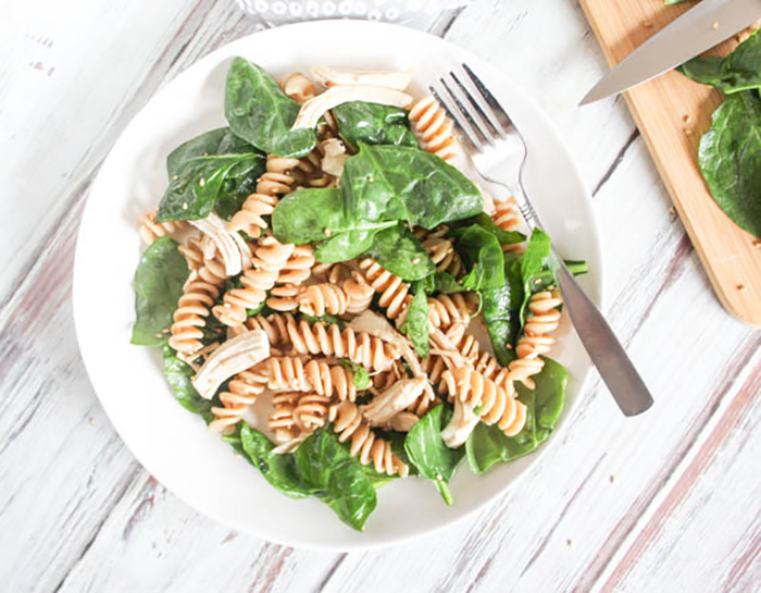 overhead view of pasta salad on a white plate