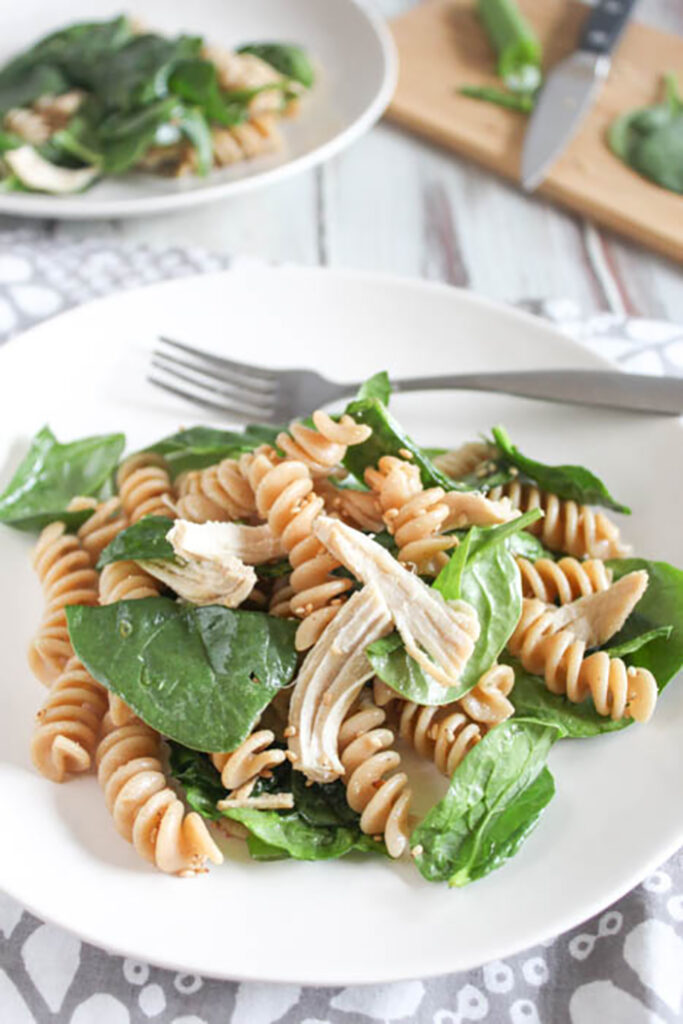 spinach pasta salad on a plate