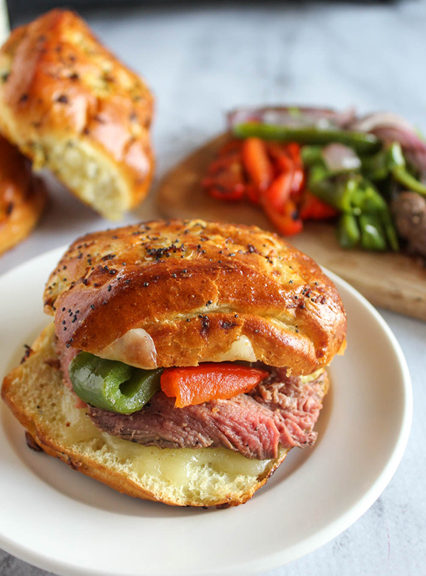 homemade cheesesteak sandwich on a soft onion roll