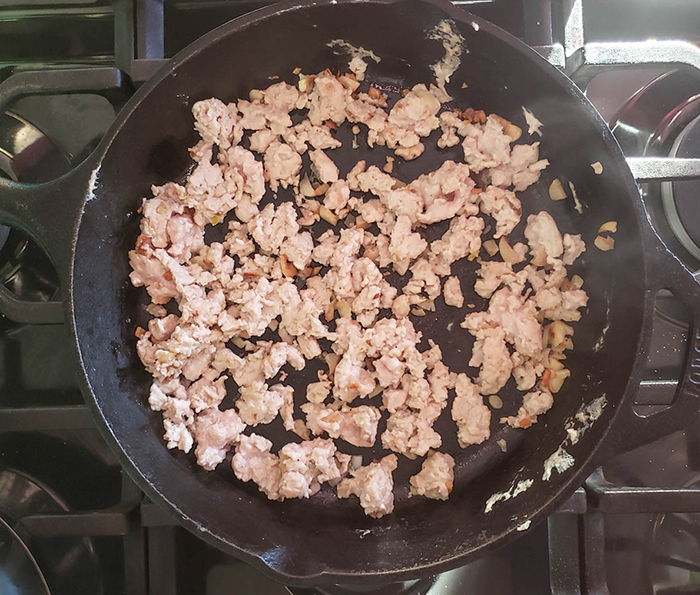 ground chicken cooking in a skillet