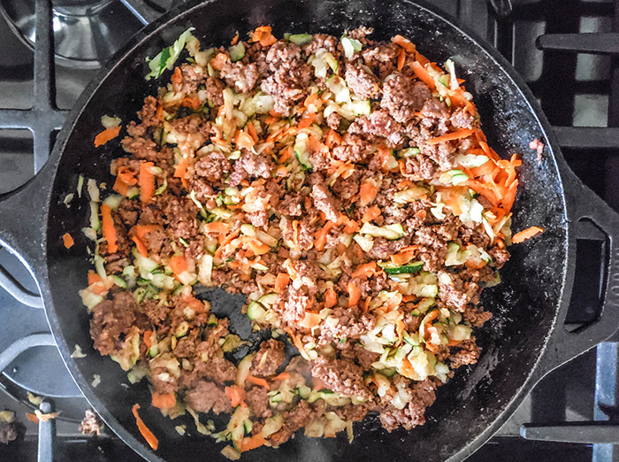 cooked-taco-meat-in-skillet-with-shredded-vegetables