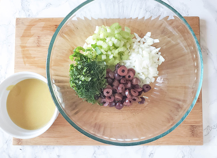 fresh herb potato salad veggies in a bowl