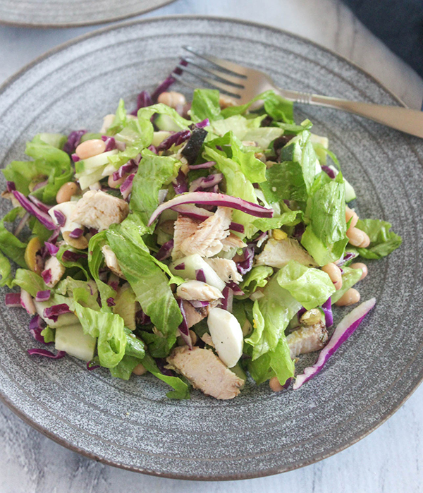 Chicken Chopped salad in a plate with a fork