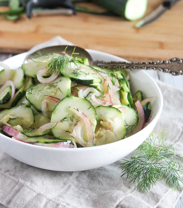 cucumbers with onions and vinegar salad in a bowl