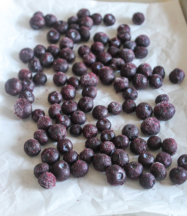 frozen blueberries on a sheet pan