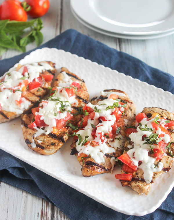 grilled chicken parmesan on a platter 