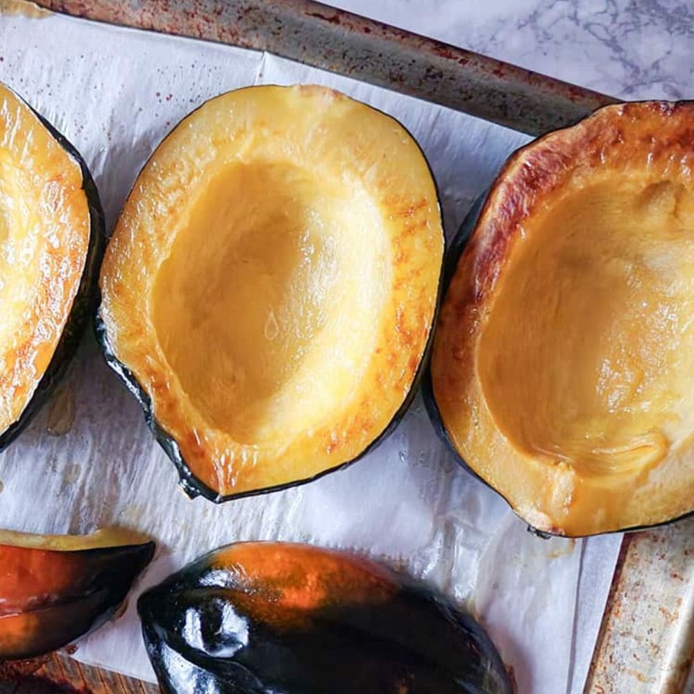 BUTTERNUT SQUASH HALVES ON A BAKING SHEET 
