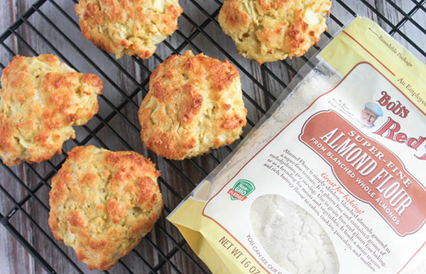 cheddar apple biscuits on a rack with almond flour