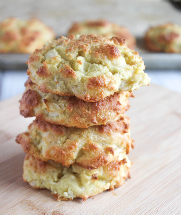 four apple cheddar biscuits stacked up
