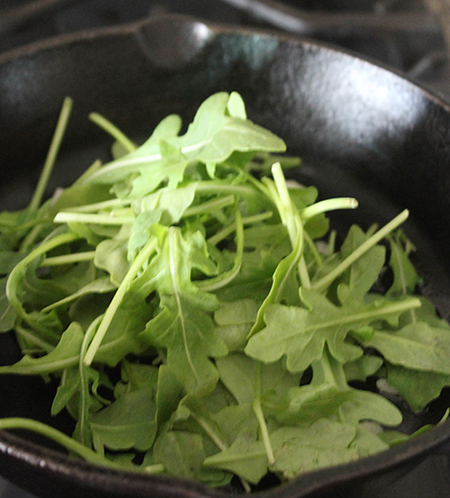 arugula in a skillet