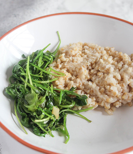 arugula and whole grains in a bowl