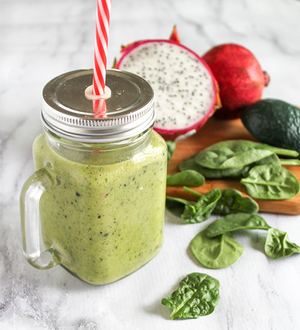 smoothie in a jar with a lid and a straw