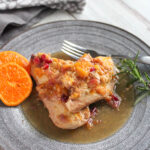 cranberry chicken on a plate with a fork