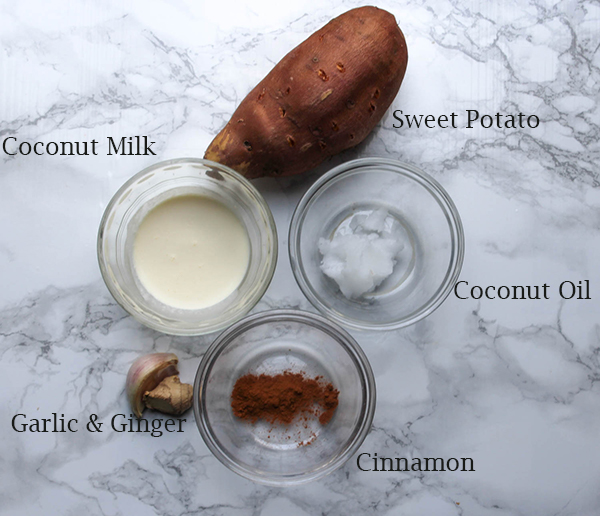 All of the ingredients for the sweet potato mash, sweet potato, coconut milk, coconut oil, garlic, ginger and cinnamon