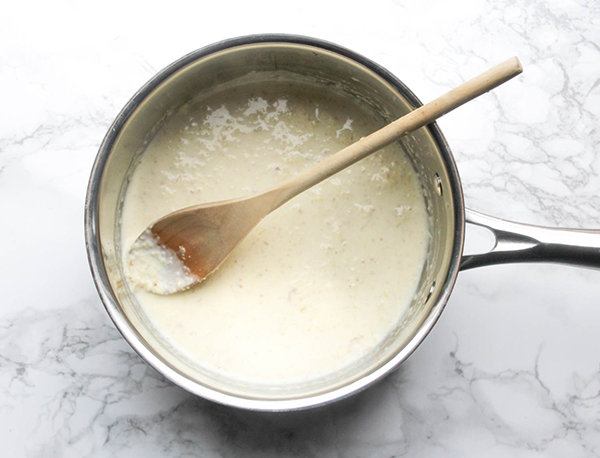 milk garlic and ginger cooking in a saucepan