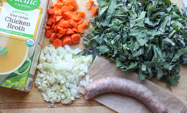 chicken broth carrots onions kale and sausage ingredients for the soup