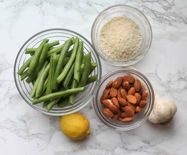 the ingredients: Green beans, almonds, bread crumbs, garlic, and lemon in little bowls