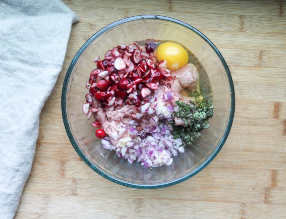 ingredients for turkey meatballs in a mixing bowl