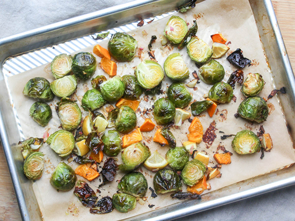 brussels sprouts and citrus roasted on a tray