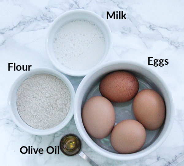 The ingredients- flour, milk, eggs and olive oil