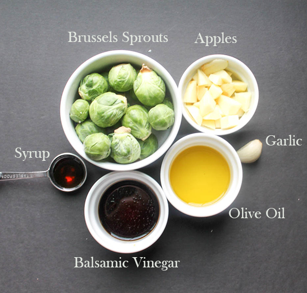 all of the ingredients: brussels sprouts, apples, syrup, garlic, olive oil and balsamic vinegar