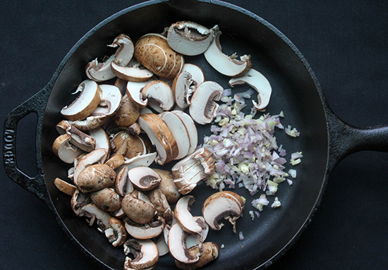 mushrooms garlic and shallots in a skillet